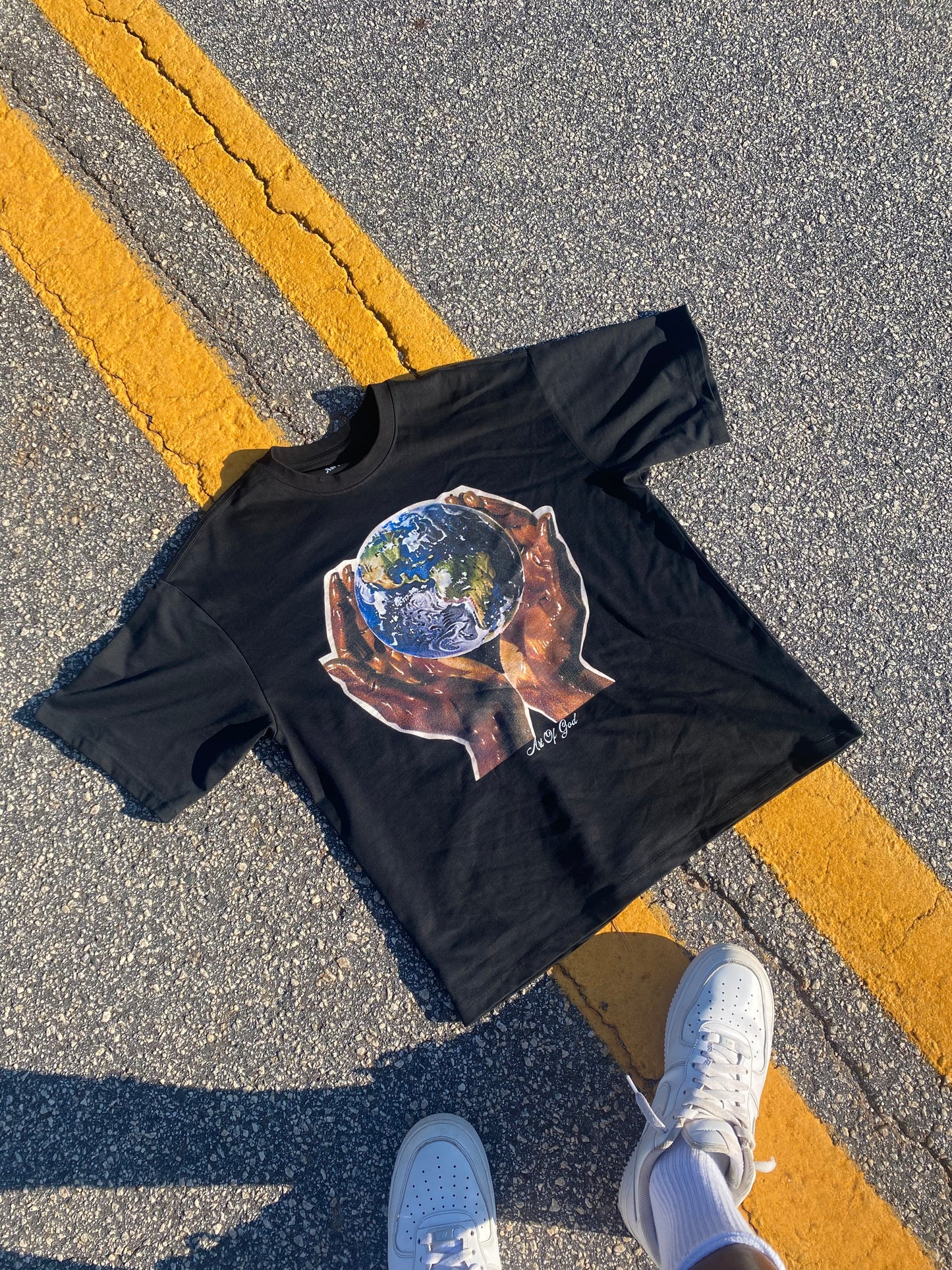 World In His Hands Black Tee